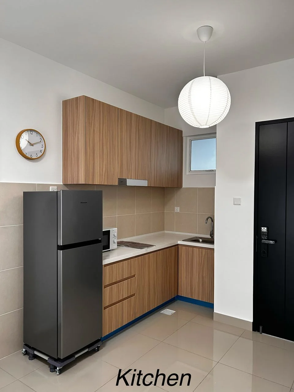 Completed modern kitchen cabinets and fridge